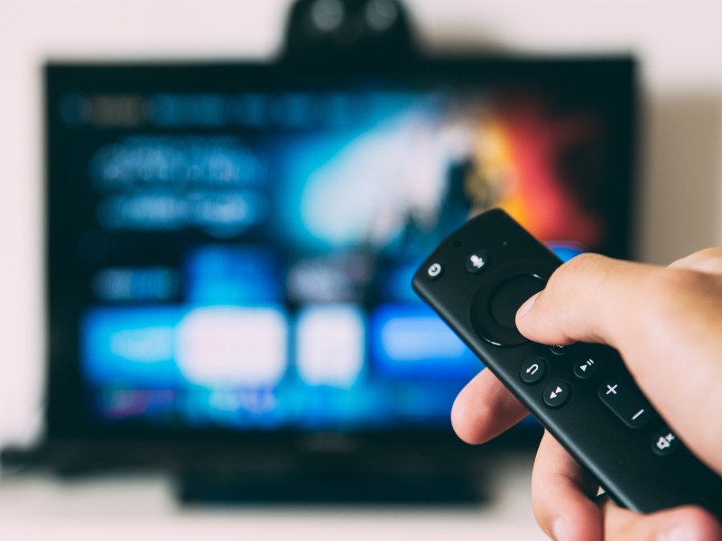 pointing remote at the television